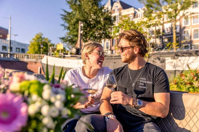 Amsterdam: 2-Hour Luxury Canal Cruise with Snacks & Drinks - What the guide adds to the ride