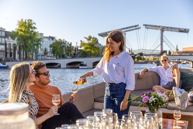 Amsterdam 2 Hour Small-Group Canal Cruise with Dutch Snacks & Bar - Anne Frank House and Westerkerk from the canal