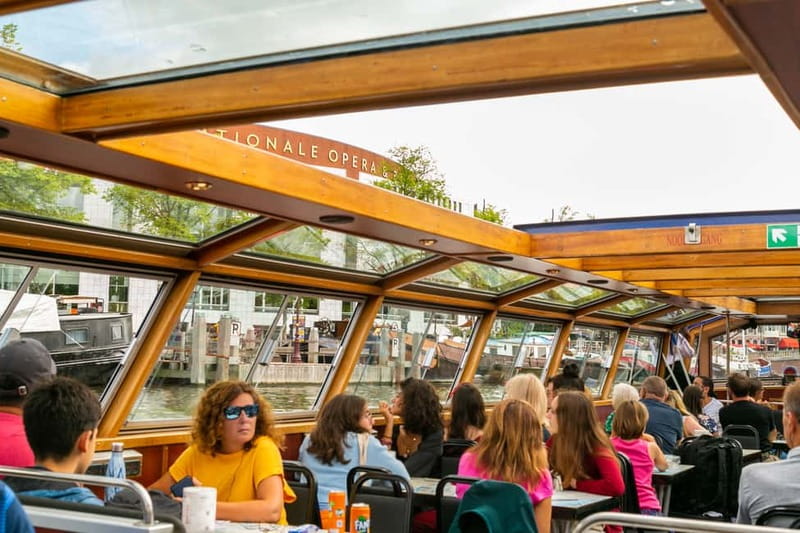Amsterdam: 75 Minute City Canal Cruise with Audio Guide - The boat, comfort, and snackbox option