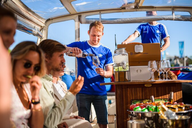 Amsterdam: Canal Booze Cruise with Unlimited Drinks Option - Amsterdam Light Festival views and evening timing