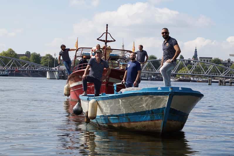 Amsterdam: Canal Cruise on a Wooden Refugee Boat - Ninety minutes through Amsterdam’s canals