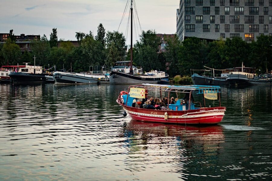Amsterdam: Canal Cruise on a Wooden Refugee Boat - Personal stories from guides with refugee backgrounds