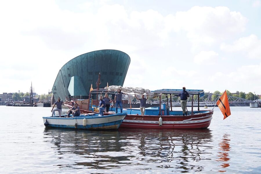 Amsterdam: Canal Cruise on a Wooden Refugee Boat - Weather, comfort, and practical preparation