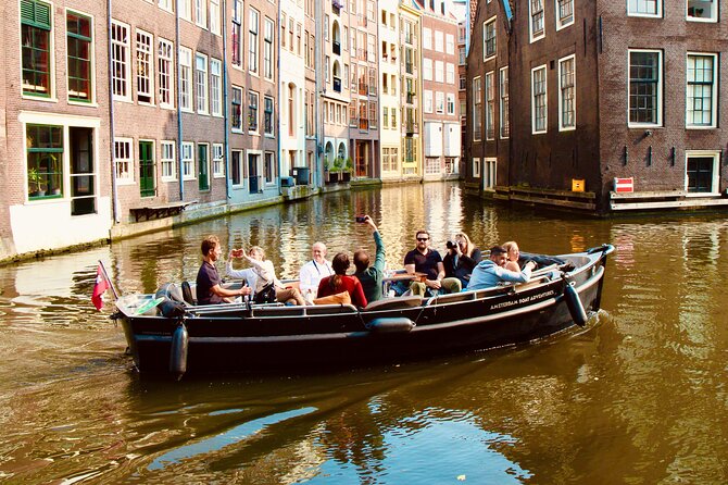 Amsterdam Canal Tour by Open Boat – 90 min Small Group Experience - Geldersekade, Nieuwmarkt, and the old city wall