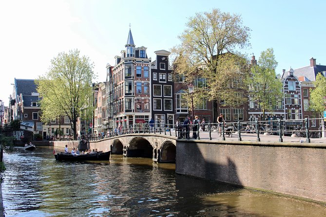 Amsterdam Canal Tour by Open Boat – 90 min Small Group Experience - Prinsengracht houseboats and the final Skinny Bridge crossing