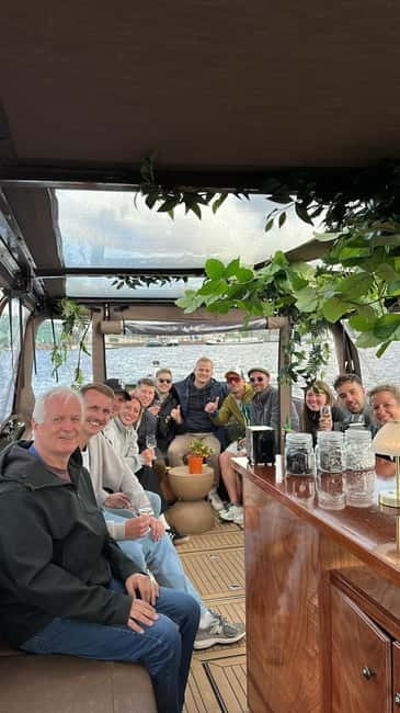 Amsterdam: Covered Heated Canal Cruise with Bitterballen - The first stretch: Amsterdam from a comfortable seat