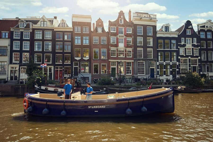 Amsterdam: Cozy Evening Canal Cruise With Open Bar Option - Rokin and the return to Floating Amsterdam