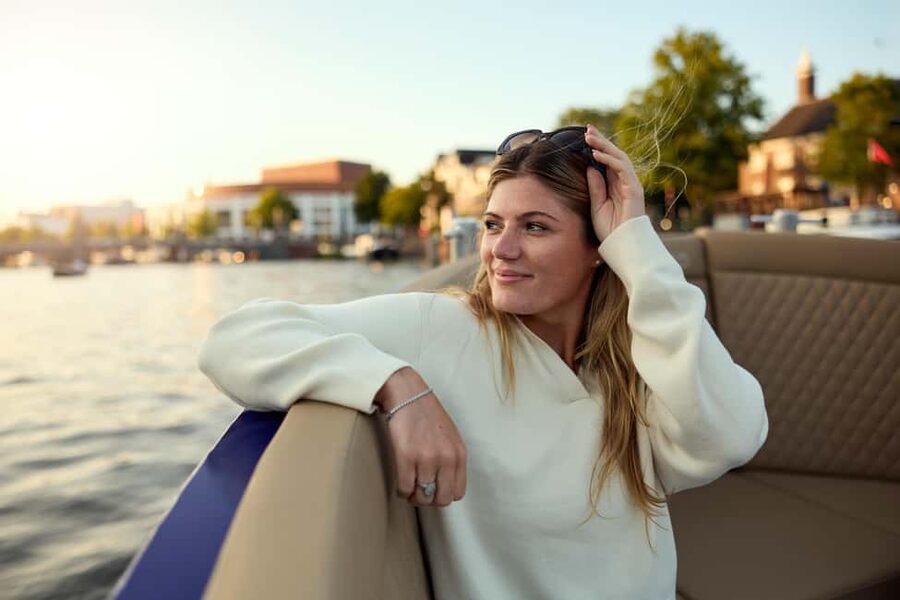 Amsterdam: Cozy Evening Canal Cruise With Open Bar Option - A small boat with a relaxed evening mood
