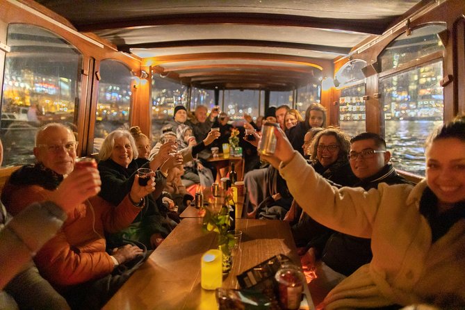 Amsterdam Evening Canal Cruise with Live Guide and Onboard Bar - Drinks, cheese, and the mood on board
