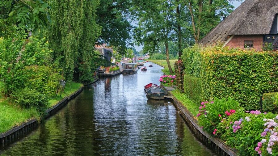 Amsterdam: Giethoorn Tour with Canal Cruise and Windmills - Giethoorn by Canal: The Most Relaxed Hour of the Day