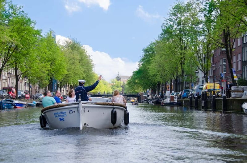Amsterdam: Guided City Highlights Open Boat Canal Cruise - Why the small boat changes the canal ride