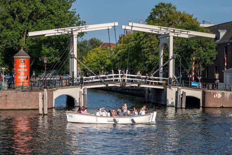 Amsterdam: Guided City Highlights Open Boat Canal Cruise - Westerkerk, Prinsengracht, and the Anne Frank House area