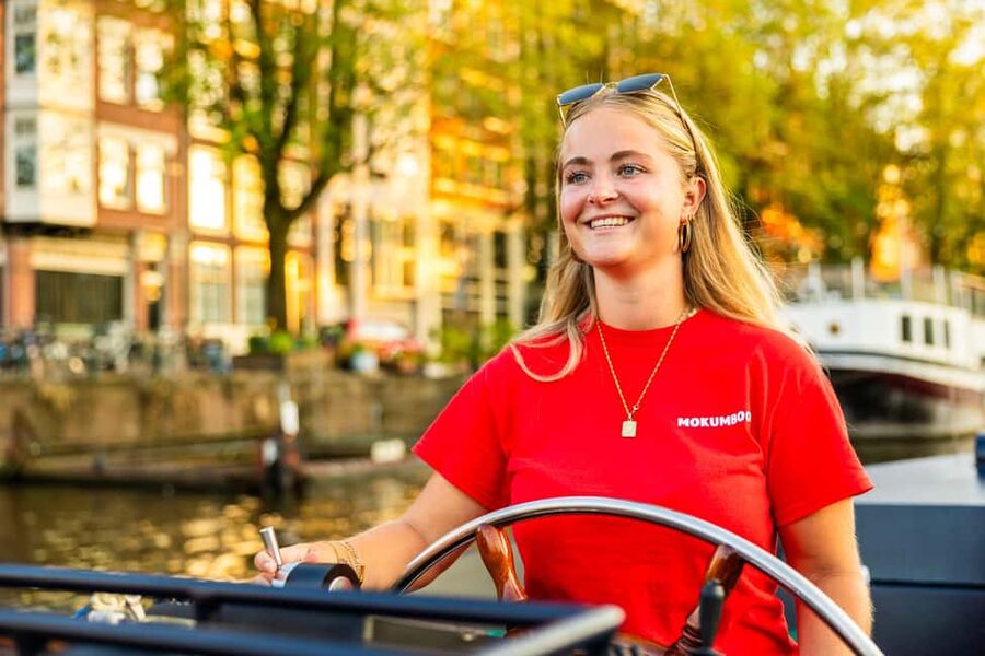 Amsterdam: Guided Open Boat Canal Cruise Including Drink - What the guides add to the ride