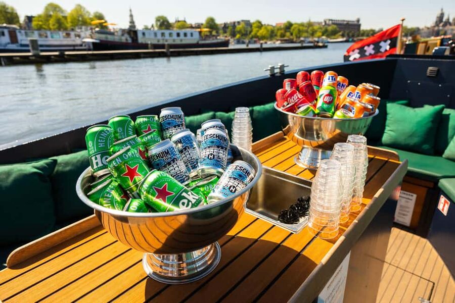 Amsterdam: Guided Open Boat Canal Cruise Including Drink - The eastern harbor and old city sights