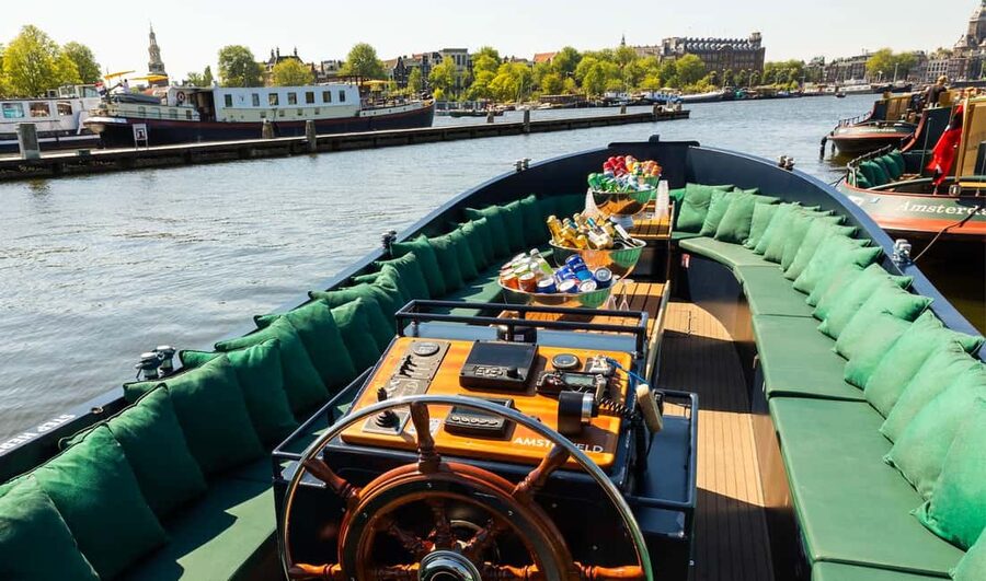 Amsterdam: Guided Open Boat Canal Cruise Including Drink - The western canal belt and Anne Frank House