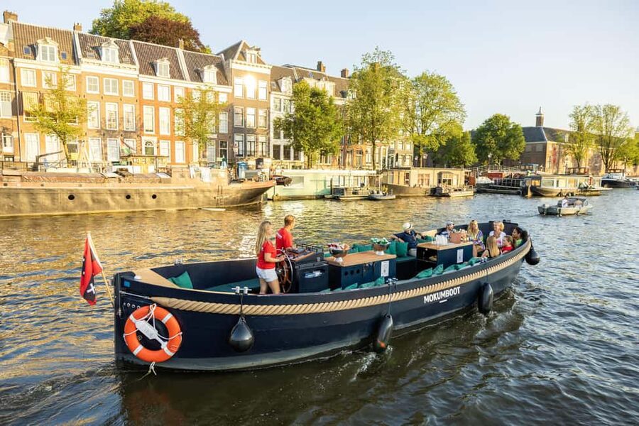 Amsterdam: Guided Open Boat Canal Cruise Including Drink - Why the quiet electric boat matters
