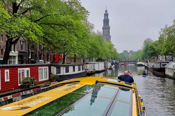 Amsterdam: Historic City Sightseeing Canal Cruise - The former Lutheran church and Amsterdam Centraal