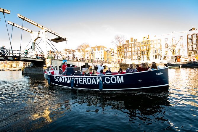 Amsterdam Open Boat Cruise with Live Guide and Two Drinks - The old center, canal houses, and Amsterdam’s more complicated side