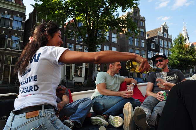 Amsterdam Open Boat Cruise with Live Guide and Two Drinks - NEMO, the Maritime Museum, and the eastern canals