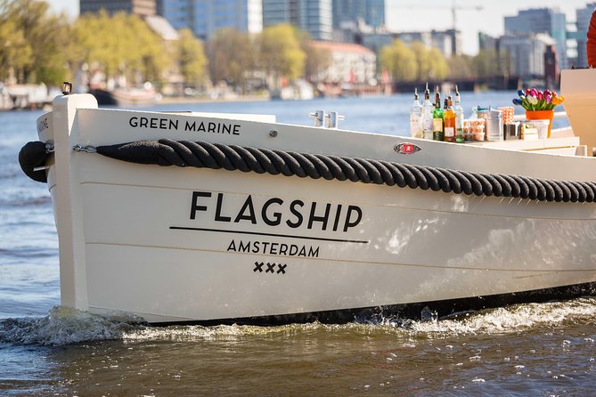 Amsterdam: Saloon Boat Cruise + Unlimited Drinks & Bite option - Opera, architecture, and Amsterdam’s odd houses