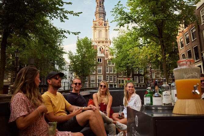 Amsterdam: Saloon Boat Cruise + Unlimited Drinks & Bite option - From the Amstel River to the city’s beginnings