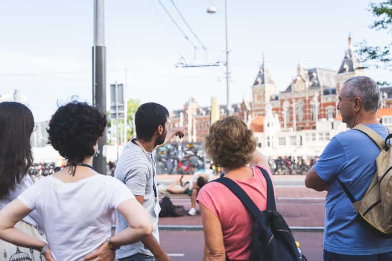 Amsterdam Small-Group Walking Tour with Canal Cruise - Zeedijk and Nieuwmarkt Show a Less Polished Amsterdam