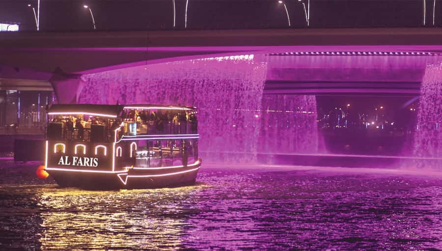 Dubai: Water Canal Cruise and La Perle Show with Dinner - Dinner with music and city lights