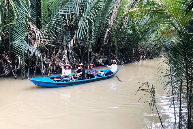 From Ho Chi Minh City: Discover Mekong Delta & Coconut Village - Taking the boat along the Tien River
