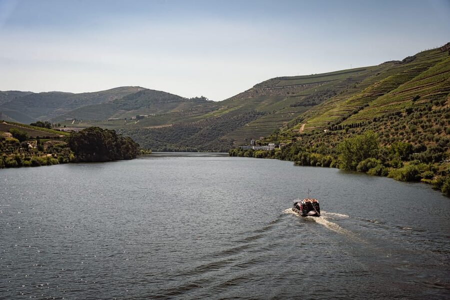 From Pinhão: Douro Valley Rabelo Boat Tour with Port Wine - Leaving Pinhão beneath the Eiffel Bridge