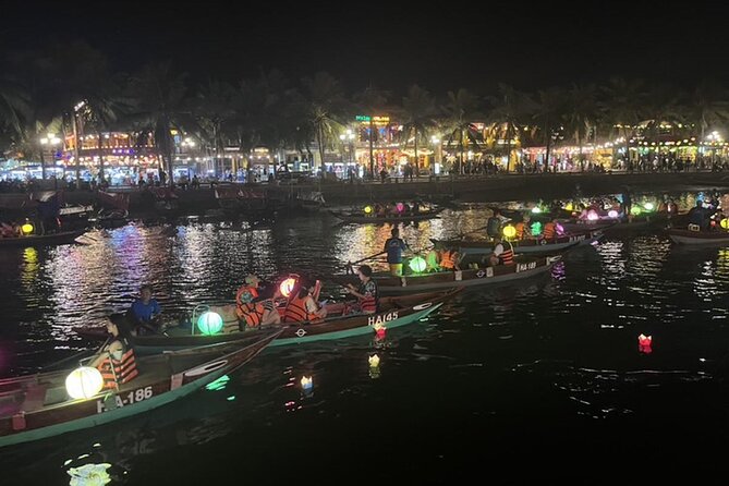 Hoai River Boat Trip by Night with Release Lantern - Releasing your flower lantern on the river