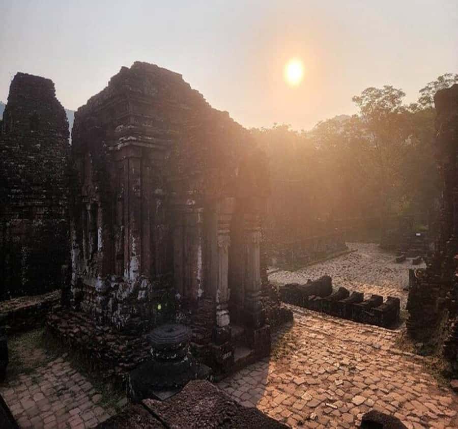 Hoi An: Half-Day to My Son Sanctuary & Sunset River Cruise - What the guide adds at the temple towers