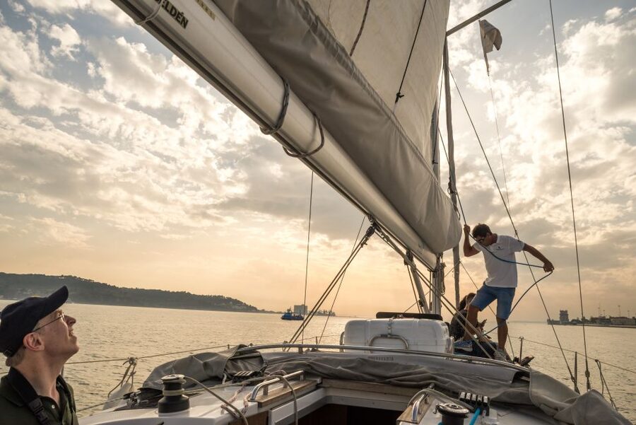 Lisbon: Private Sunset Cruise on the Tagus River with Drink - Under the 25 de Abril Bridge toward central Lisbon