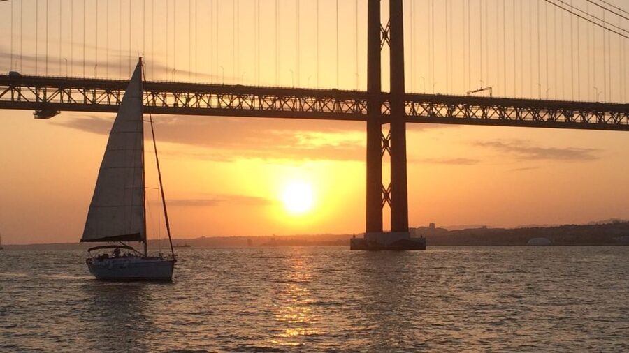 Lisbon: Private Tagus River Sunset Cruise on a Luxury Boat - Passing beneath the 25 de Abril Bridge