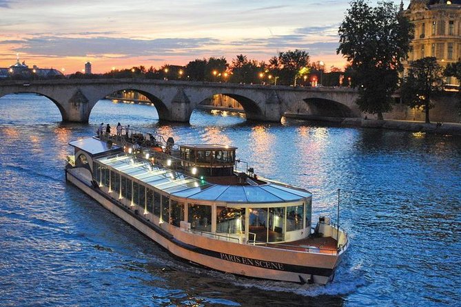 Paris en Scene 3 Course Seine River Dinner Cruise - Window-facing seats and the dinner setup