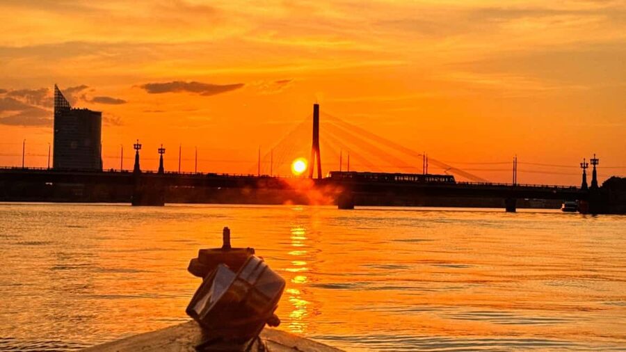Riga: Canal Boat Tour with Welcome Drink & Audio Guide - Passing Riga Central Market