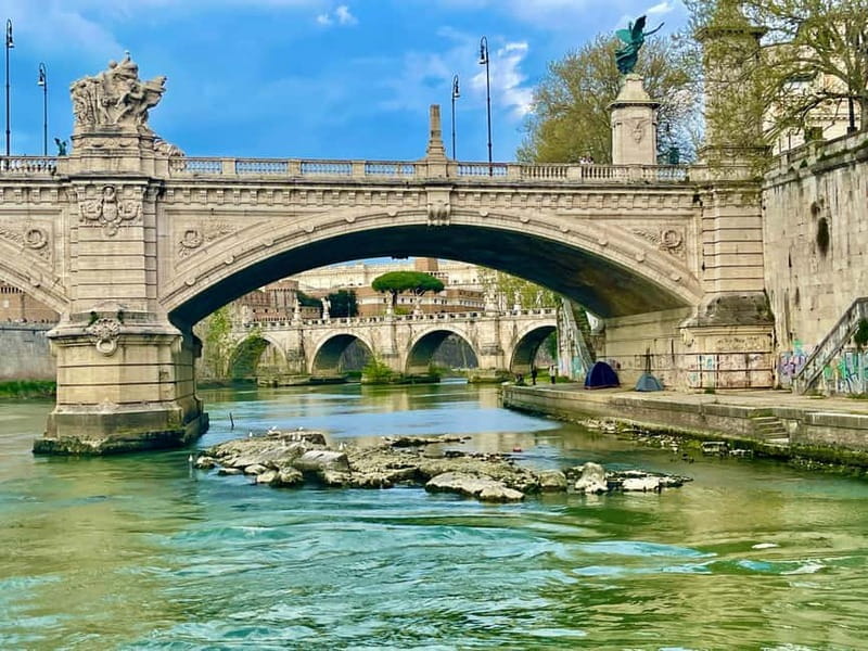 Rome: Food Tasting and Wine Pairing & Tiber River Boat Ride - Taking the Tiber boat through central Rome