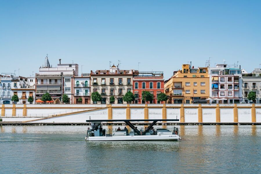 Seville: 1-Hour Guadalquivir River Sightseeing Eco Cruise - First views: Triana, the Torre del Oro, and the cathedral tower