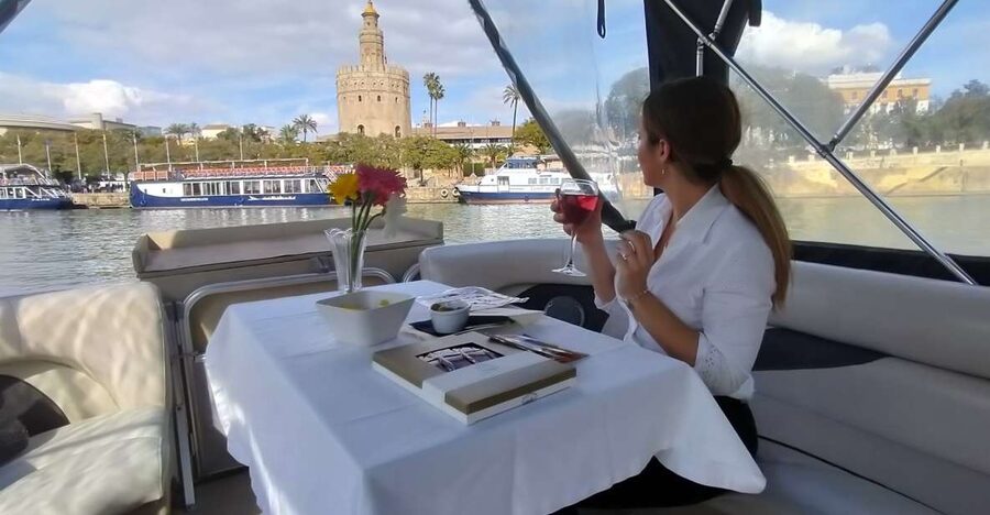 Seville: Exclusive River Boat Tour with Tapas - Passing Triana Bridge and the historic center