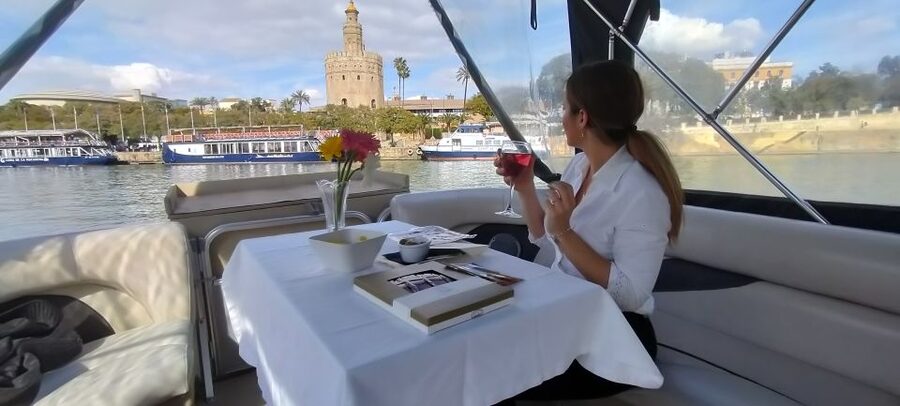 Seville: Exclusive River Boat Tour with Tapas - Tapas, cold cuts, and a single drink